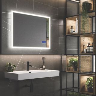 bathroom with black patter tiles and black tap
