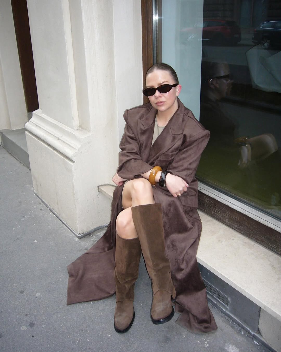 woman wearing brown suede jacket trend