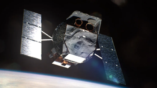 A spacecraft that looks like its wrapped in foil (it's not really, of course) up in orbit.