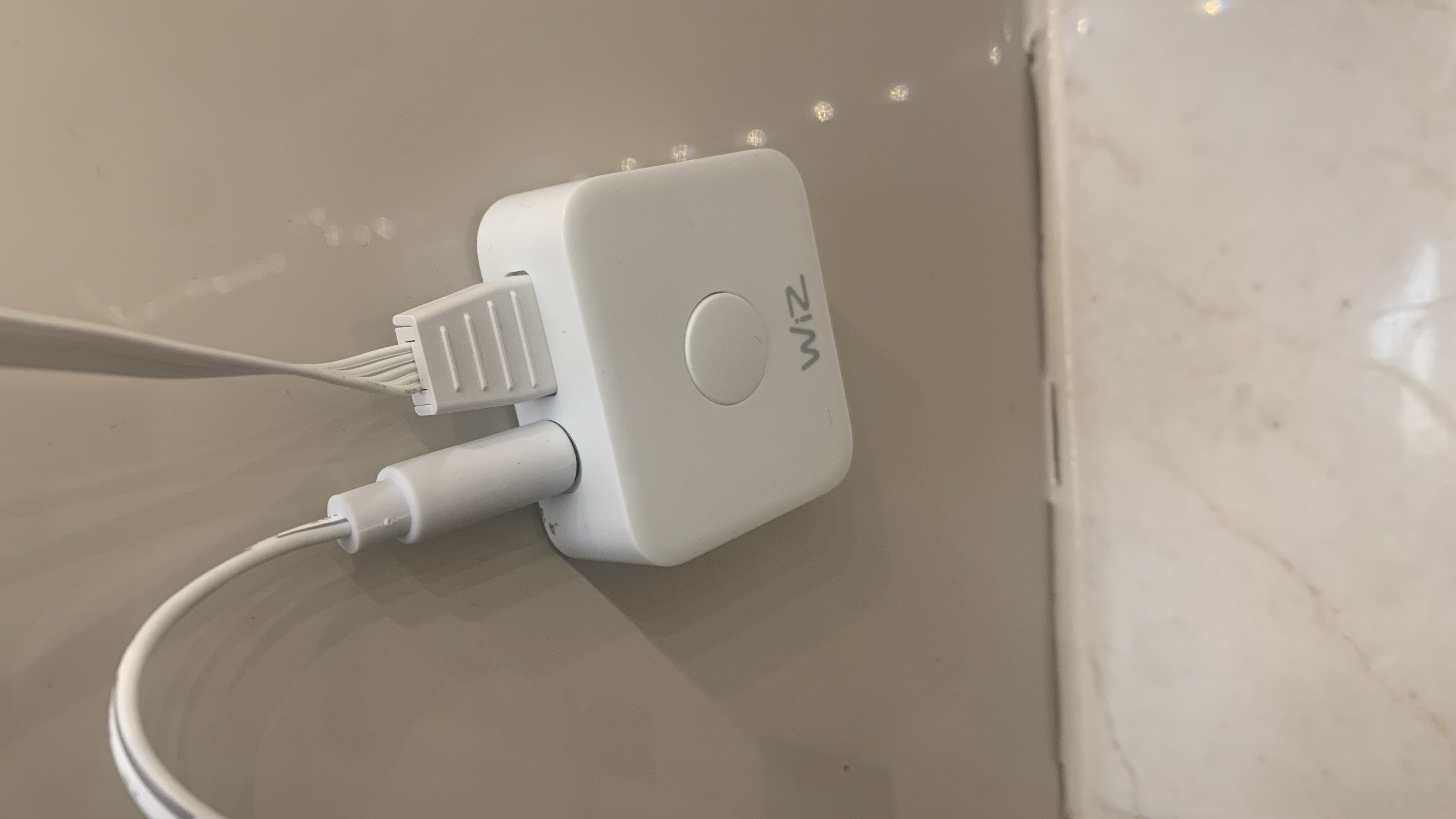 WiZ LED Strip smart light switch, stuck on a wall