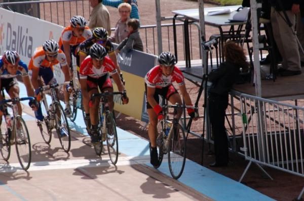 A group prepares to sprint on the velodrome at the end of Paris-Roubaix