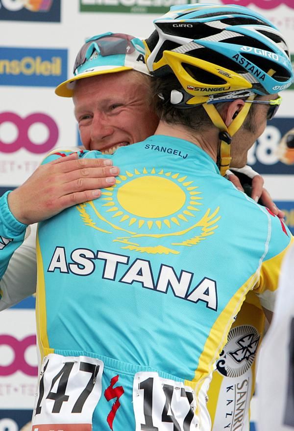Alexandre Vinokourov is embraced by Astana teammate Martin Stangelj at the finish of Liege-Bastogne-Liege