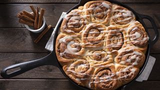 Cinnamon rolls cooking in a skillet