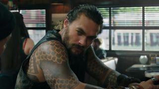 Jason Momoa in the bar as Aquaman's Arthur Curry