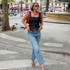 Lena wearing jeans and ballet flats