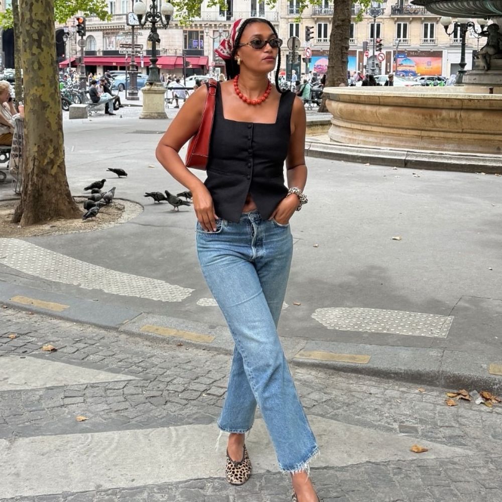 Lena wearing jeans and ballet flats