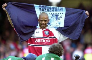 10 Mar 2001: Roy Essandoh of Wycombe celebrates after beating Leicester City in the quarter final of the AXA FA Cup after the Leicester City v Wycombe Wanderers match in the FA Cup Sixth Round at Filbert Street, Leicester. Digital Image. Mandatory Credit: Ross Kinnaird/ALLSPORT