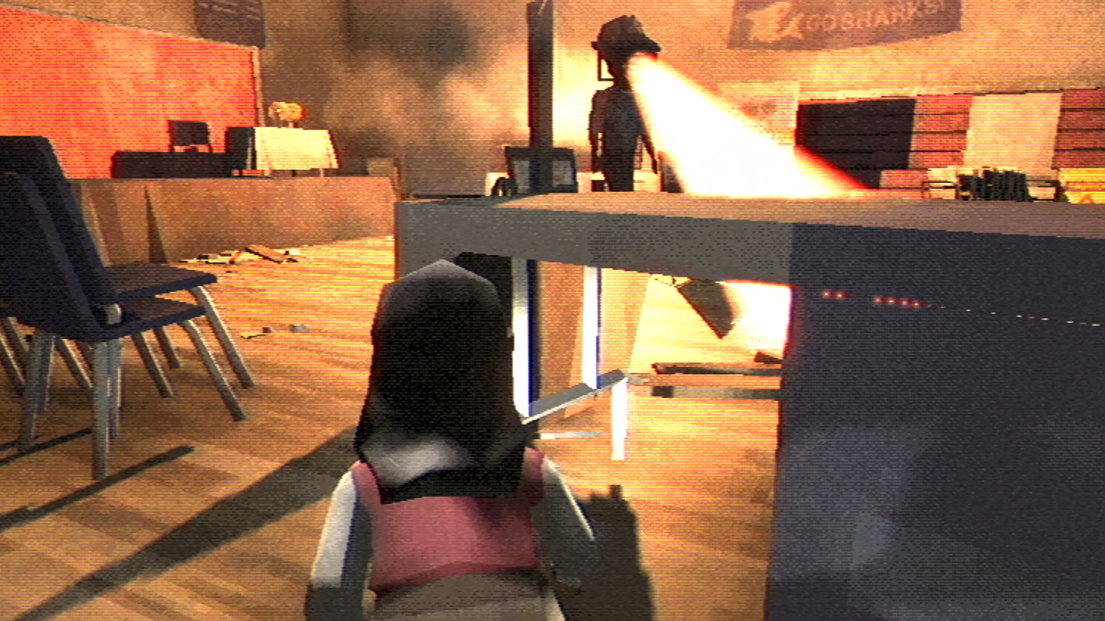 The player character hiding behind a desk while the spotlight hunts