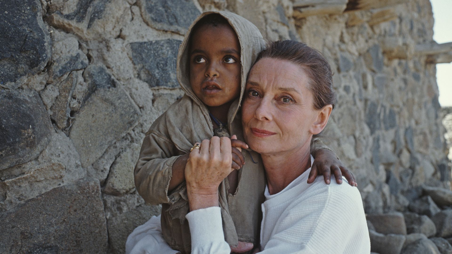 Audrey Hepburn with a child