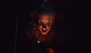 IT: Chapter 2 Pennywise luring a kid into the darkness at the fair