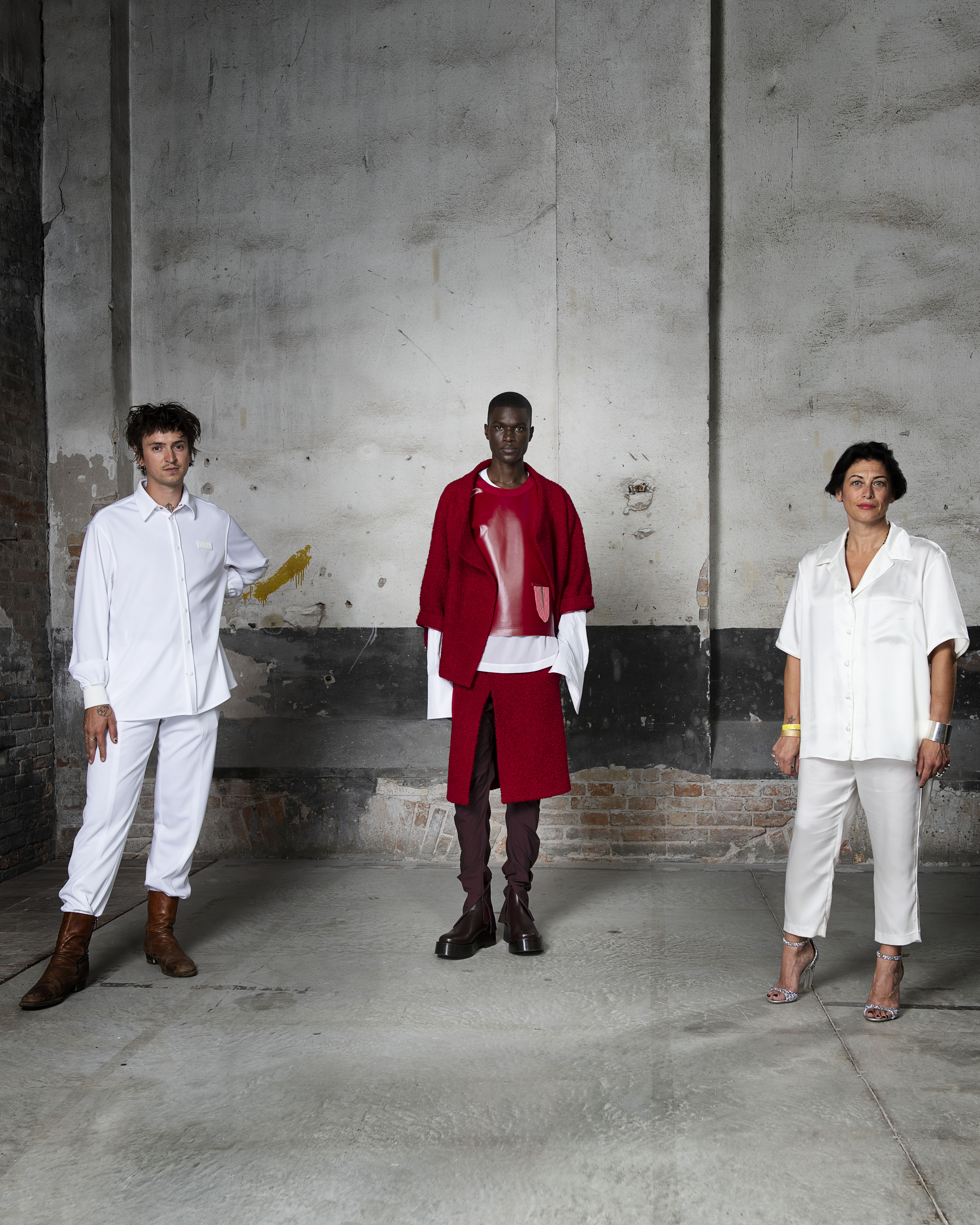 Models posing in white and red clothing