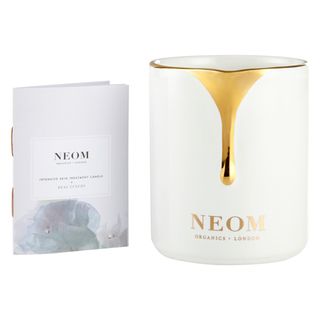 white neom skin treatment candle