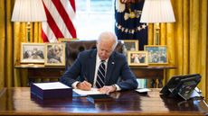 U.S. President Joe Biden participates in a bill signing in the Oval Office of the White House on March 11, 2021, in Washington, D.C.