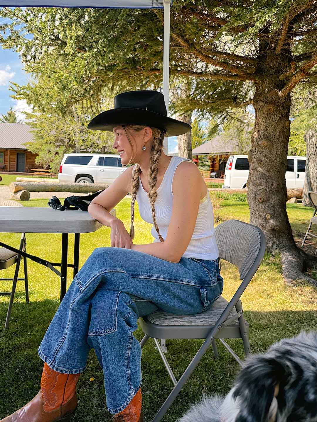 Gigi Hadid wore jeans, cowboy boots, a tank top, and Western hat inspired by her sister, Bella Hadid.