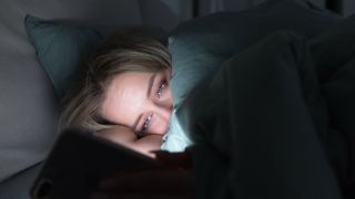 Your phone's blue light won't actually stop you sleeping, according to an expert – but your phone is still the problem