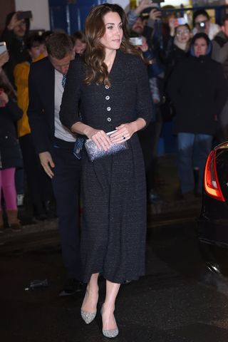 Kate Middleton wears a black dress and silver sparkly heels as she attends a charity performance of "Dear Evan Hansen" in aid of The Royal Foundation at Noel Coward Theatre on February 25, 2020 in London, England.