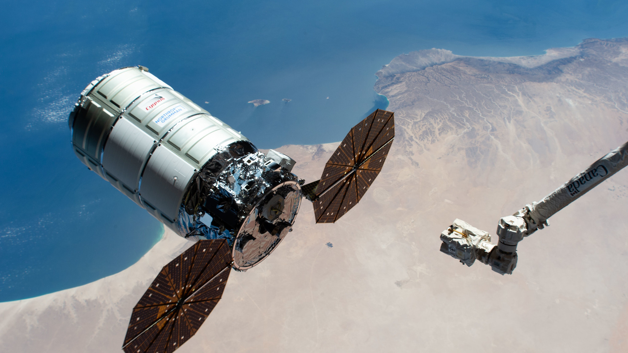 A Cygnus space freighter, Northrop Grumman’s commercial resupply craft, approaches the International Space Station. When their time in orbit is done, Cygnus vehicles are packed with discarded gear and other refuse to head for reentry over the ocean.