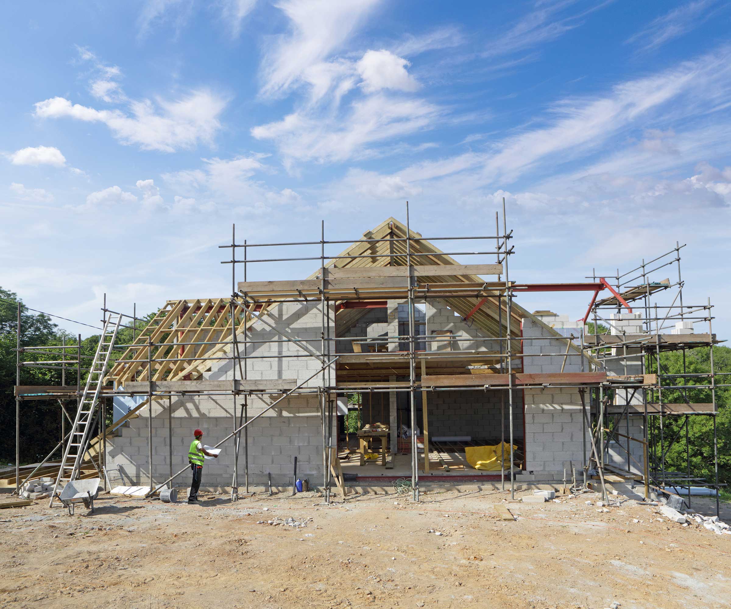 building site with a house in the process of being constructed
