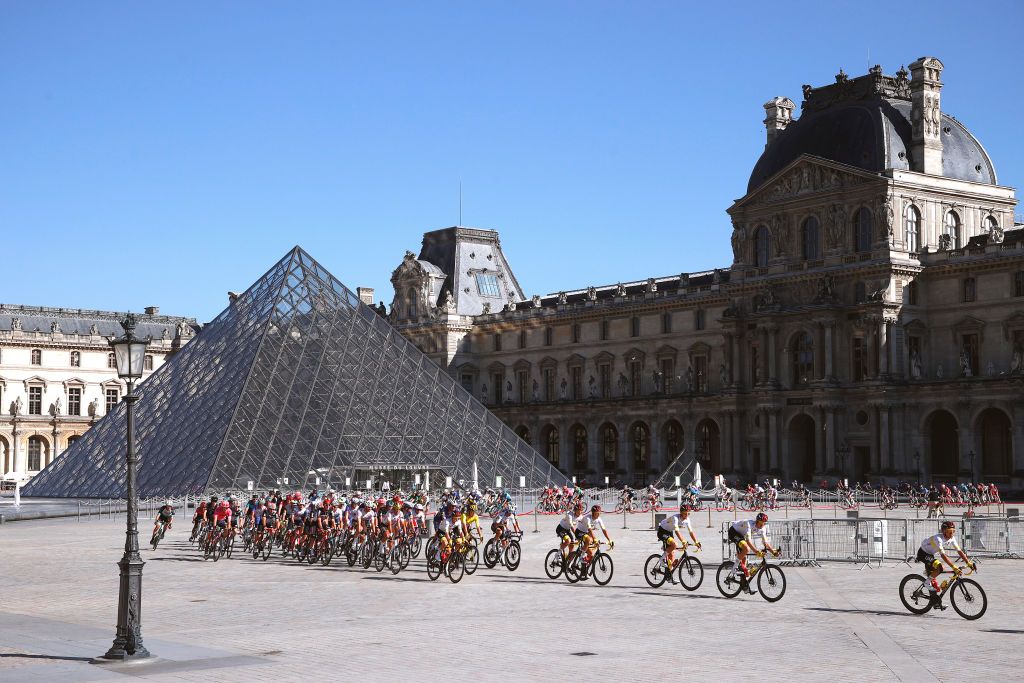PARIS FRANCE JULY 18 Tadej Pogaar of Slovenia Yellow Leader Jersey Mikkel Bjerg of Denmark Rui Costa of Portugal Davide Formolo of Italy Marc Hirschi of Switzerland Rafa Majka of Poland Brandon Mcnulty of The United States Vegard Stake Laengen of Norway and UAETeam Emirates The Peloton in front of The Louvre Museum at Paris city during the 108th Tour de France 2021 Stage 21 a 1084km stage from Chatou to Paris Champslyses LeTour TDF2021 on July 18 2021 in Paris France Photo by Chris GraythenGetty Images