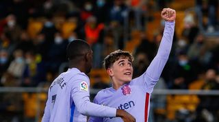 Ousmane Dembele and Gavi celebrate a Barcelona goal.