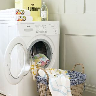 Close up of washing machine with laundry basket