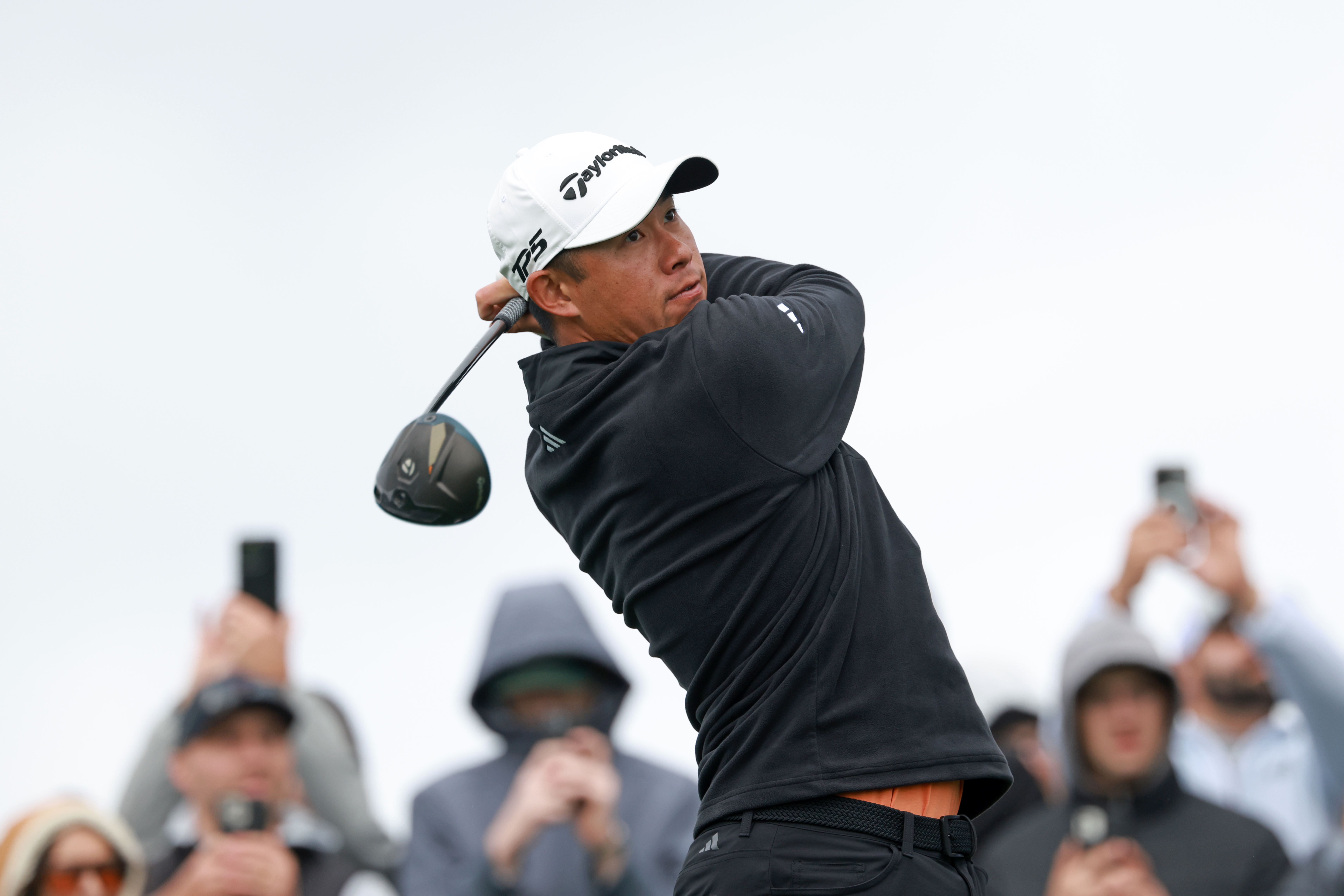 Collin Morikawa hits a driver off the tee