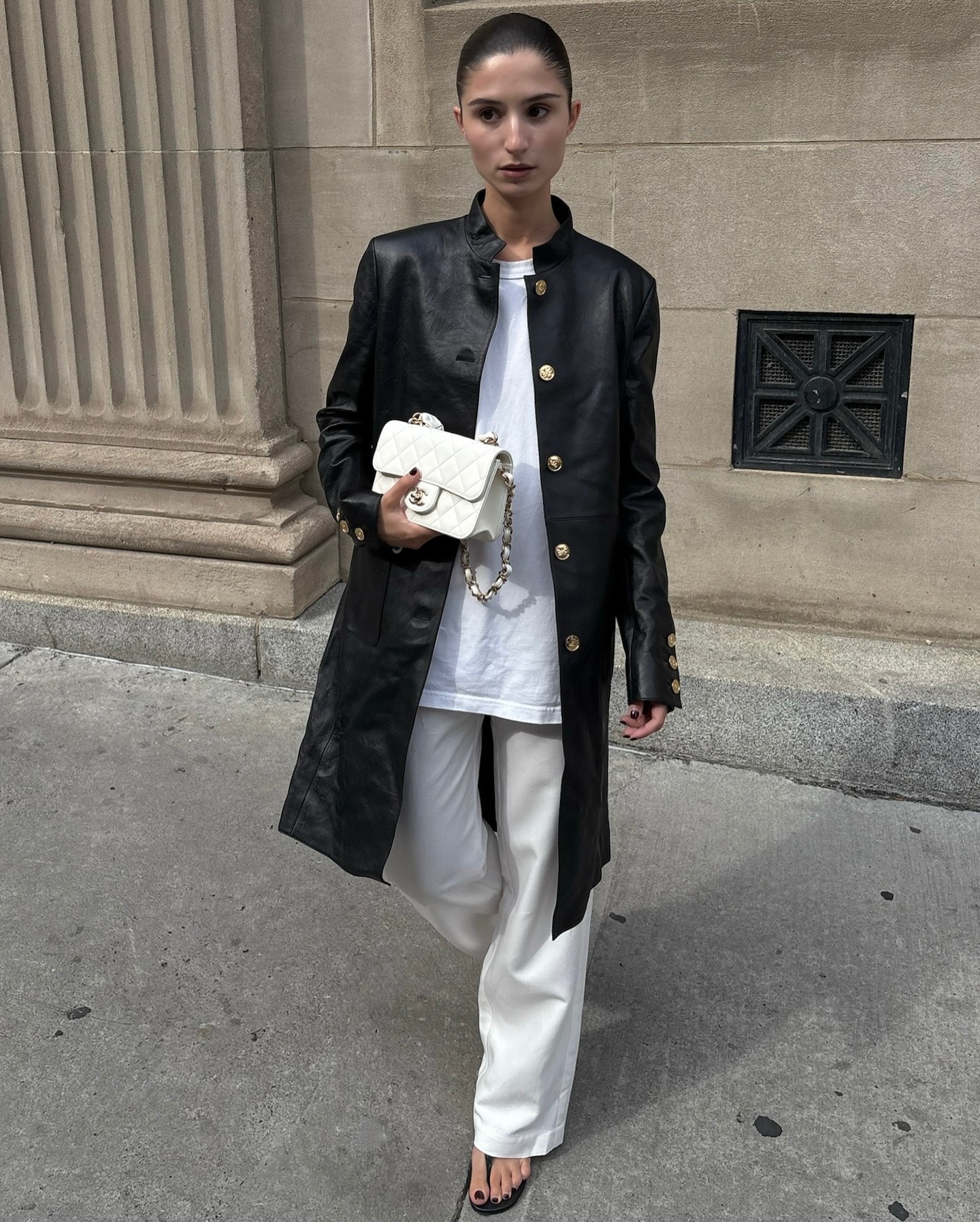A woman in a transitional season outfit.