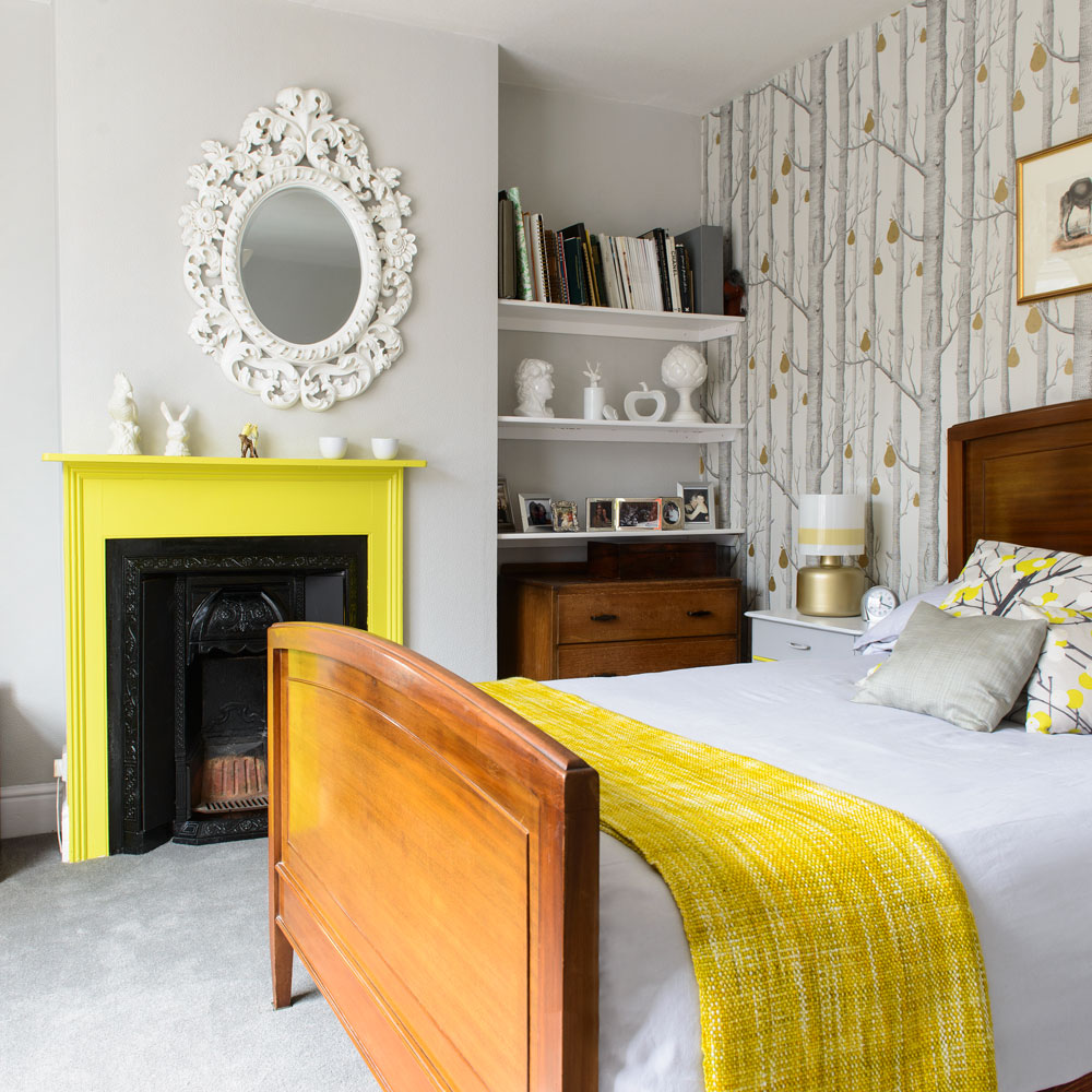 grey and yellow scheme bedroom with fireplace