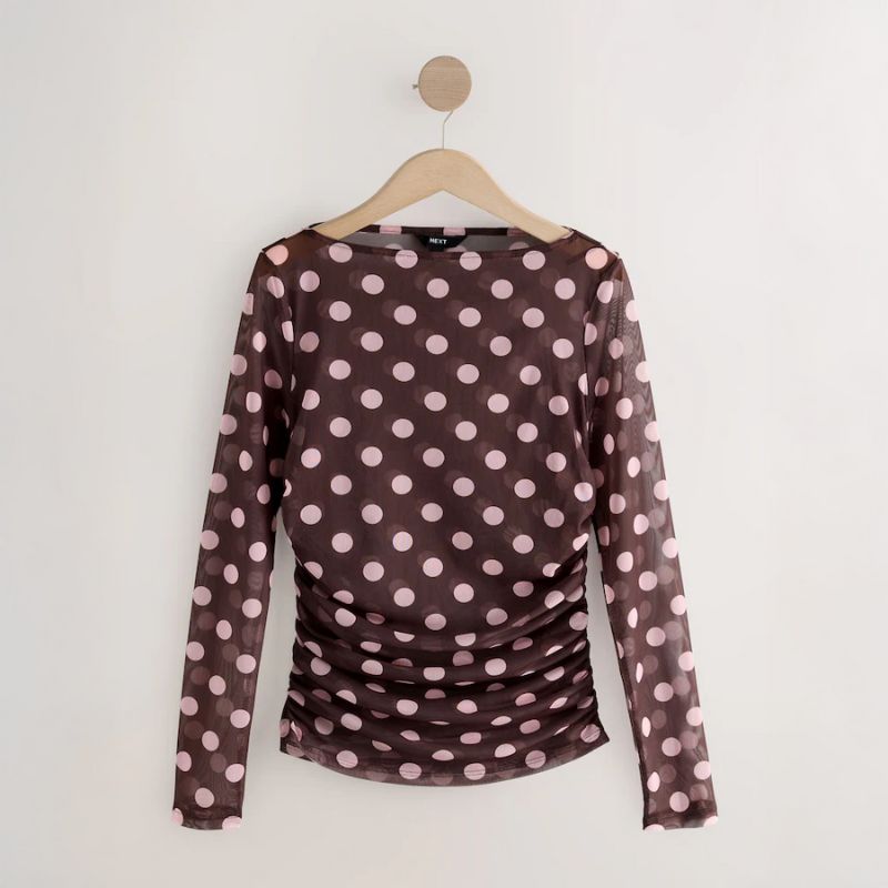A cutout of polka dot top by Next