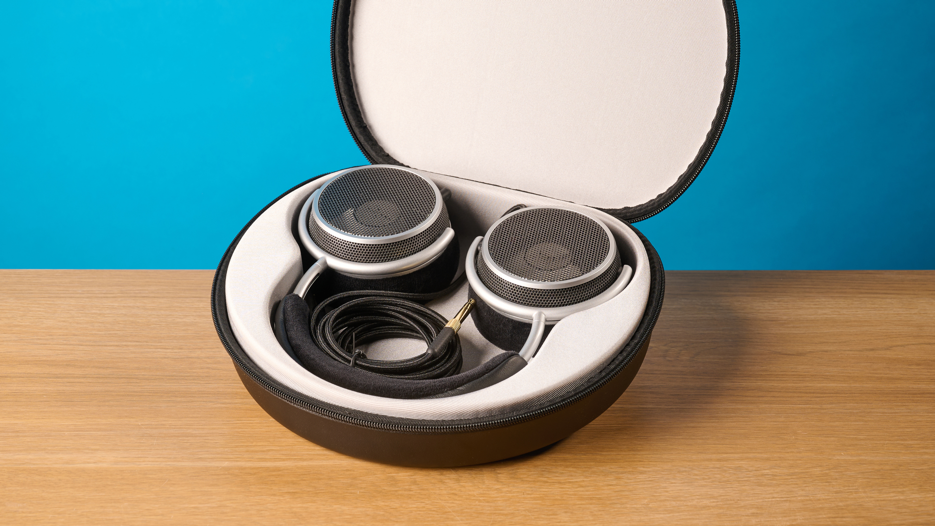 Grell OAE2 studio headphones photographed in front of a blue background