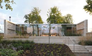 Maggie's Lanarkshire with steps going up to the front door and a garden in front