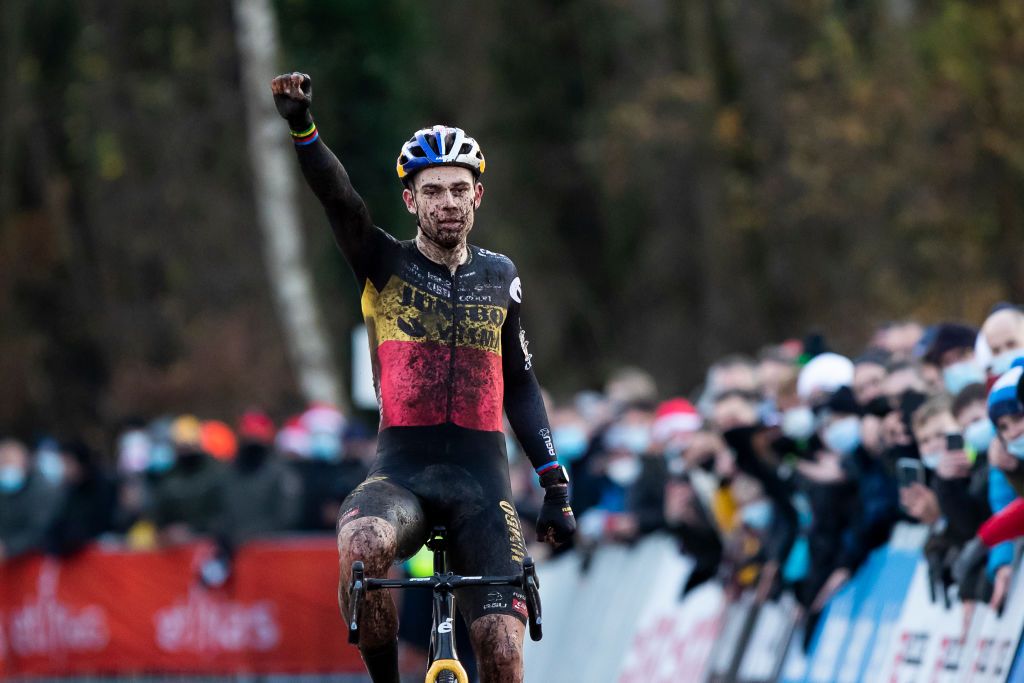 Belgian Wout Van Aert celebrates as he crosses the finish line to win the mens elite race of the 56th edition of the Robotland Cyclocross Essen in the Ethias Cross cyclocross competition Saturday 11 December 2021 in Essen BELGA PHOTO KRISTOF VAN ACCOM Photo by KRISTOF VAN ACCOMBELGA MAGAFP via Getty Images