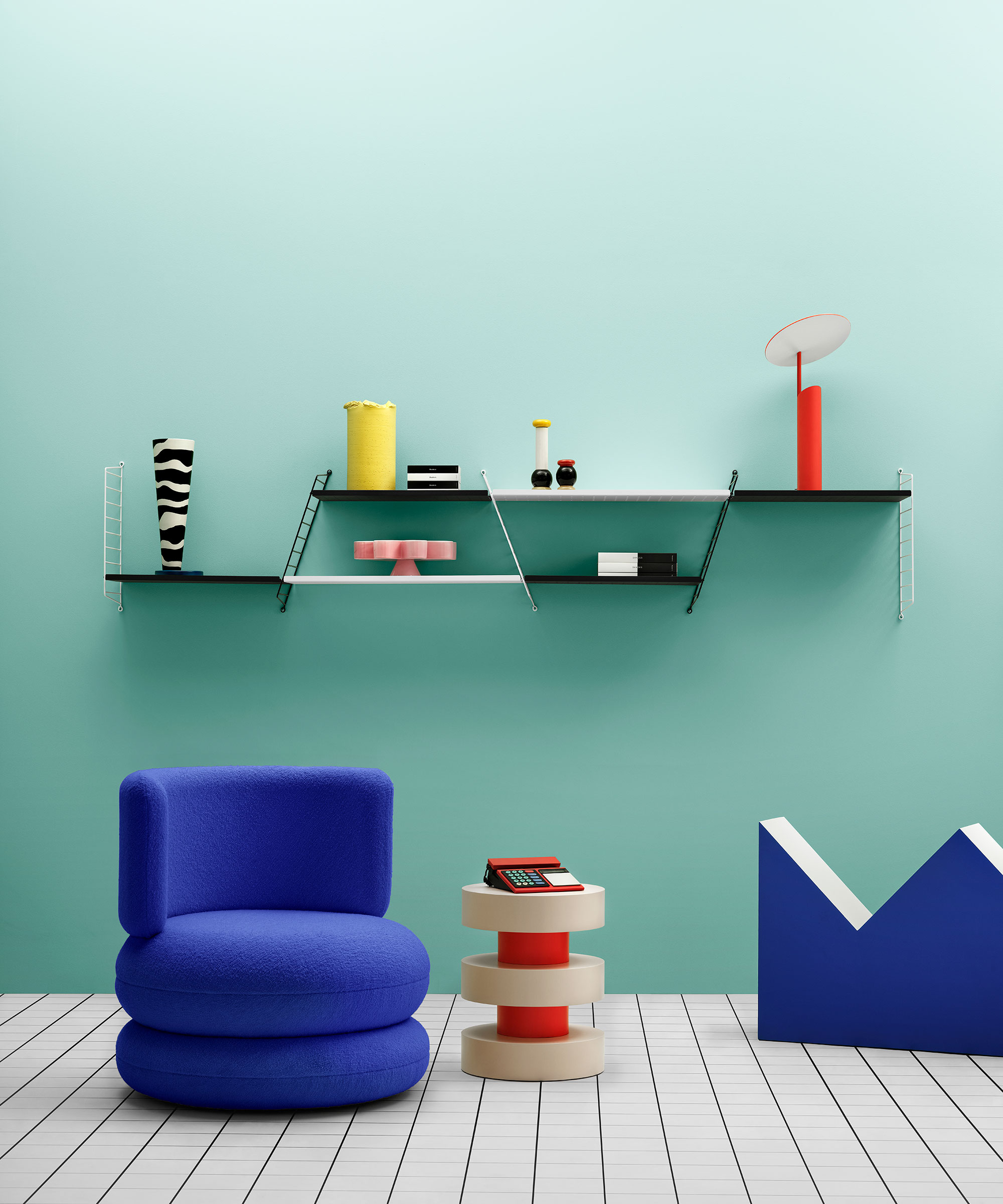 turquoise room with bright coloured 1980s inspired furniture