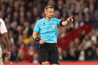 Slovenian referee Slavko Vincic gestures during the 2024 Champions League final between Borussia Dortmund and Real Madrid at Wembley Stadium in London.