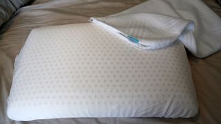 The Origin Coolmax Latex Pillow with its cover removed