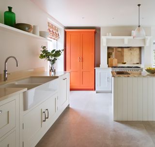 a painted kitchen idea with an orange focal point
