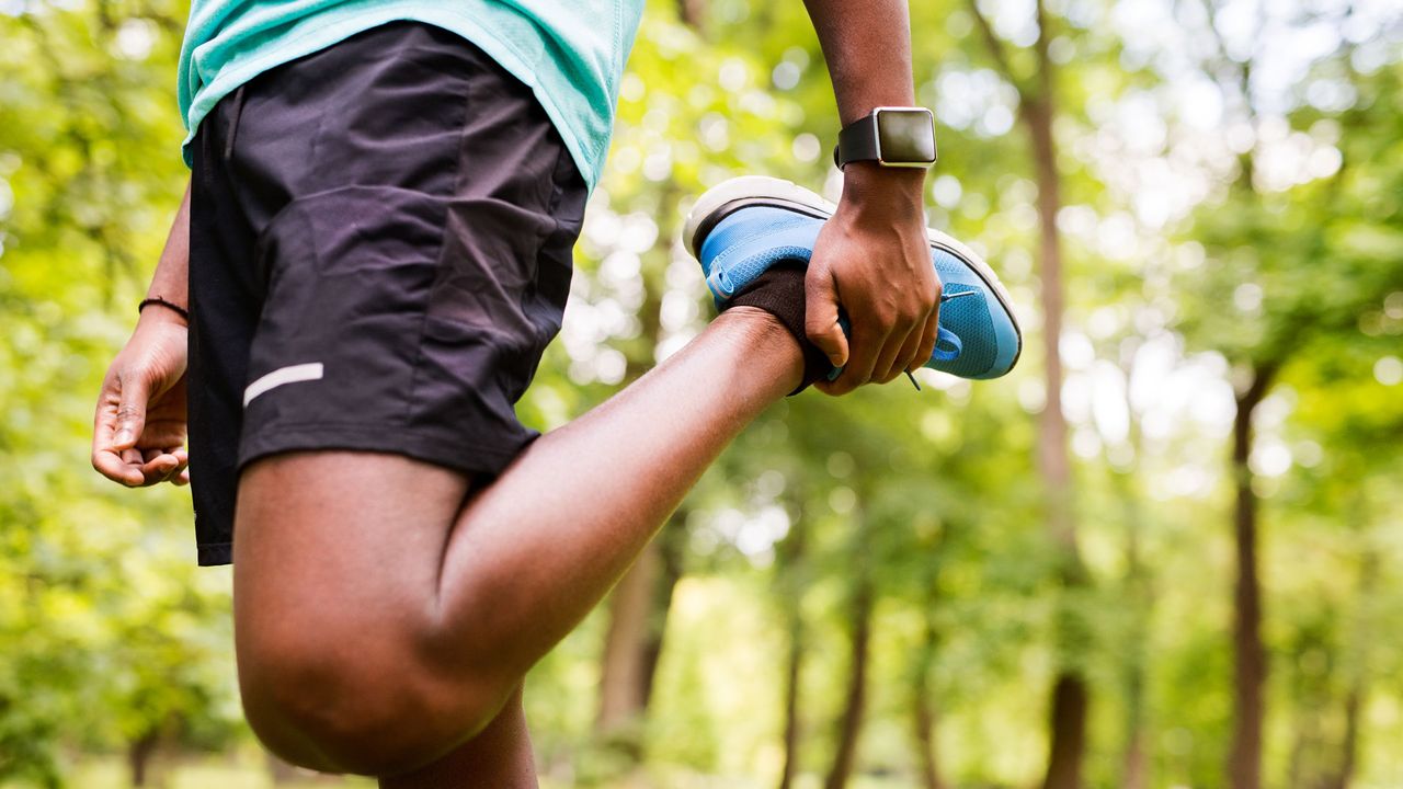 Man wearing best workout shorts while stretching