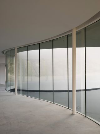 concrete, glass and curvy lines at niemeyer pavilion at chateau la coste