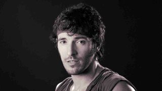 Bruce Springsteen posing for a photograph in the 1980s