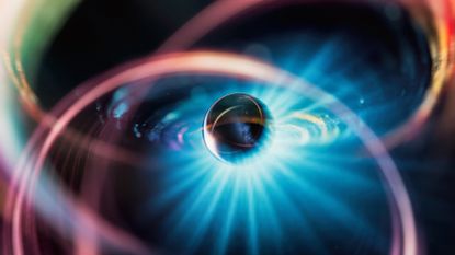 An illustration of a metal sphere surrounded by various colors and a glow of blue light.