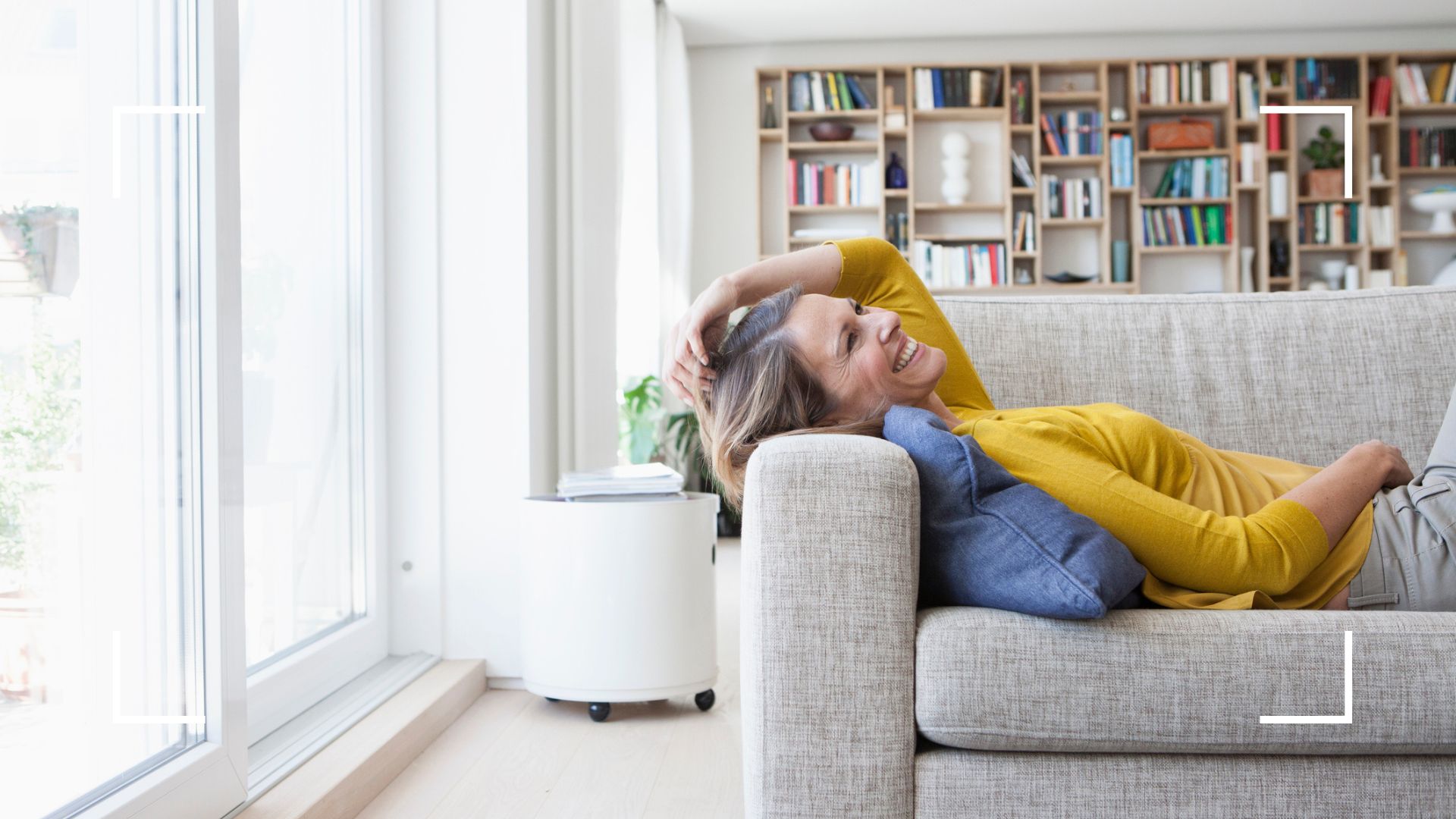 Happy woman relaxing on sofa at home - 12-second brain trick