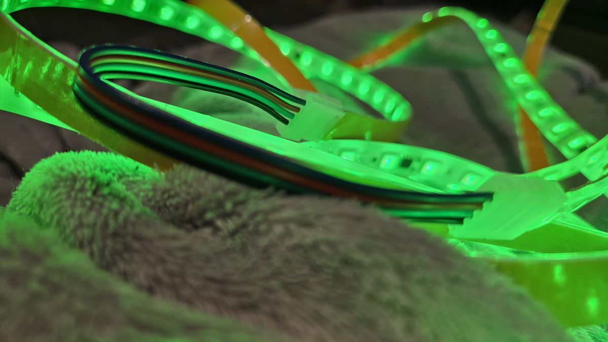 Govee Strip Light Pro 2 light strip set up on a gaming desk and around a drum set.