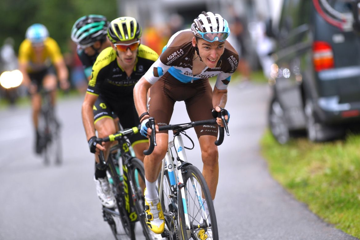 Romain Bardet attacks with Adam Yates on his wheel