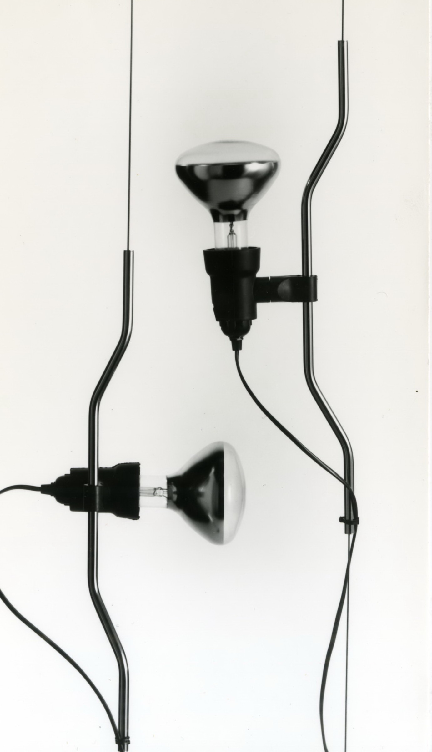 Black and white photo of Achille Castiglioni lighting designs for Flos