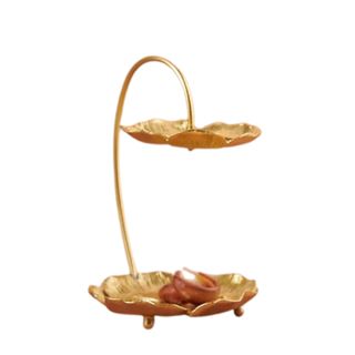 A gold hanging flower shaped jewelry stand with two circular plates