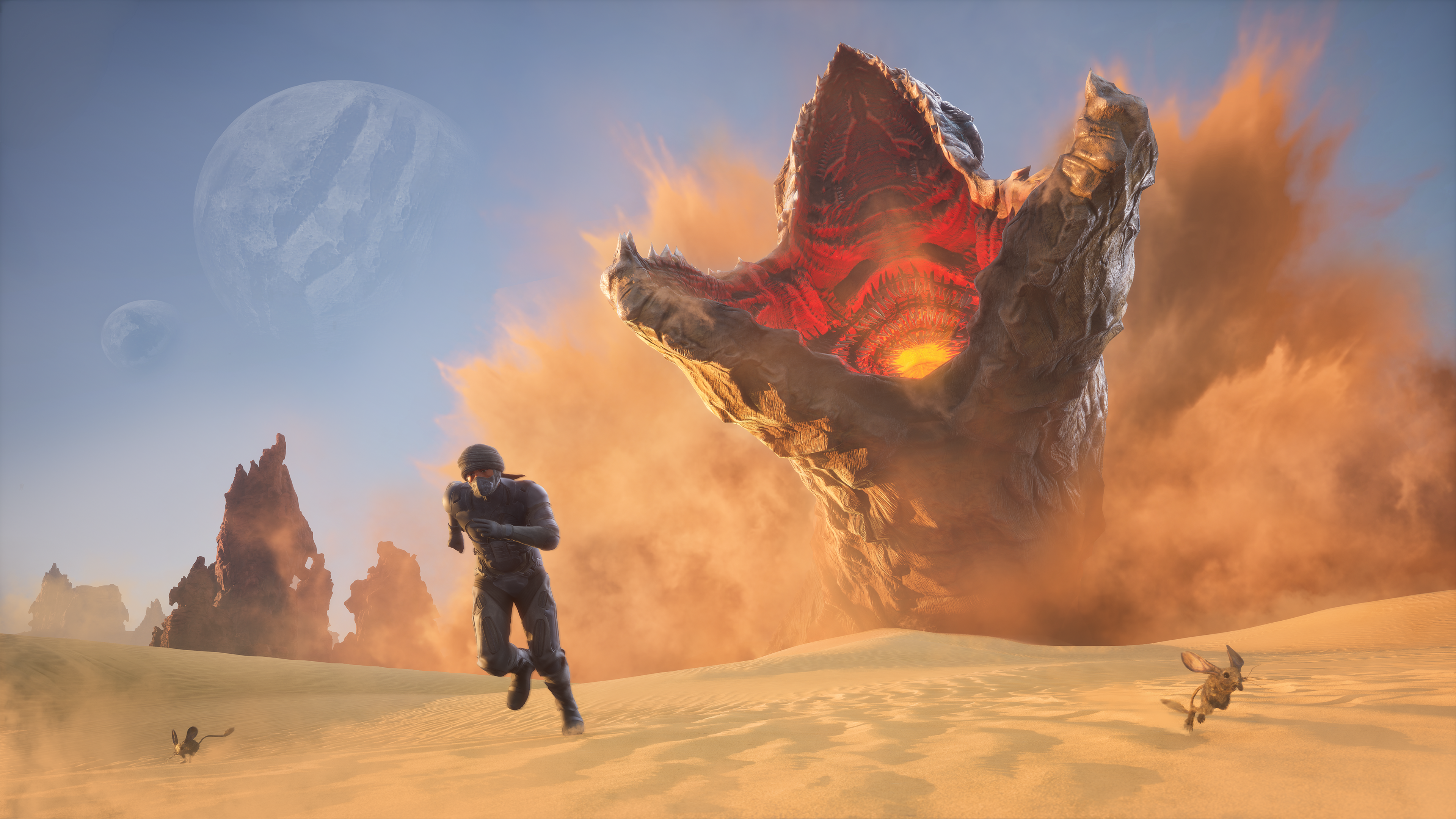 A giant worm emerges from the sand. A person flees from this eruption.
