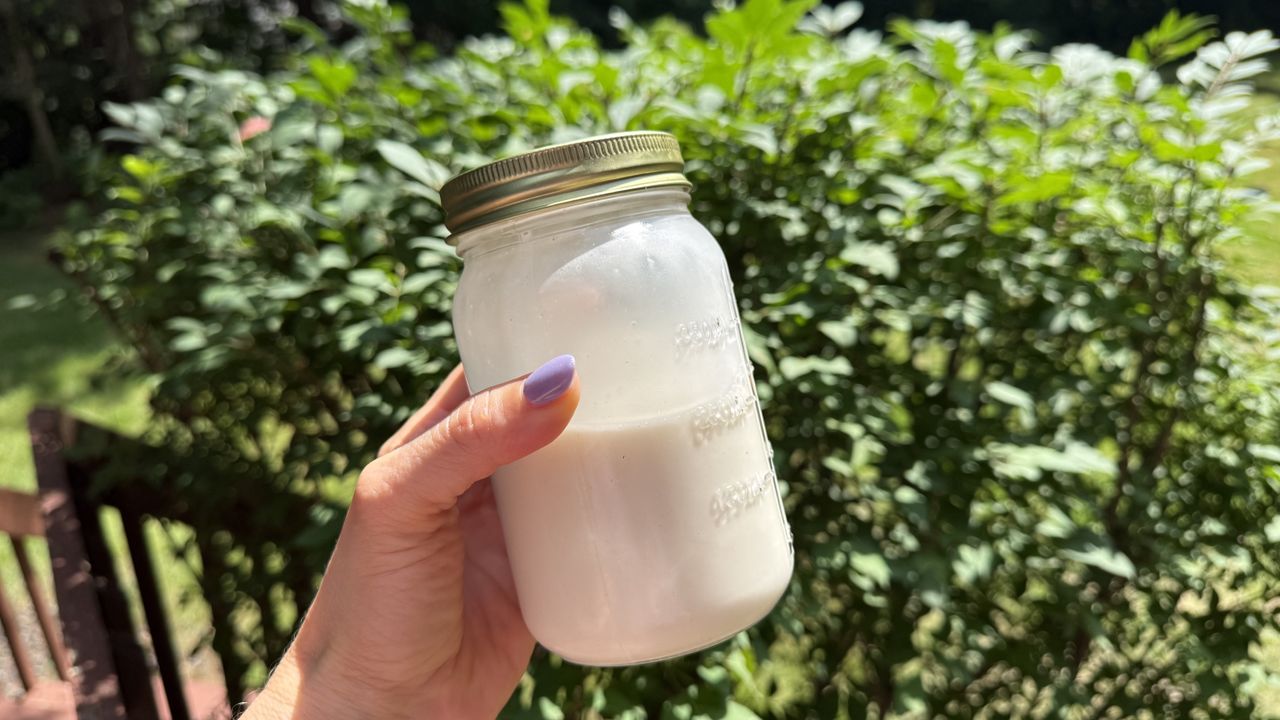 Kuvings Hands-Free Slow Juicer AUTO10 Plus oat milk in hand