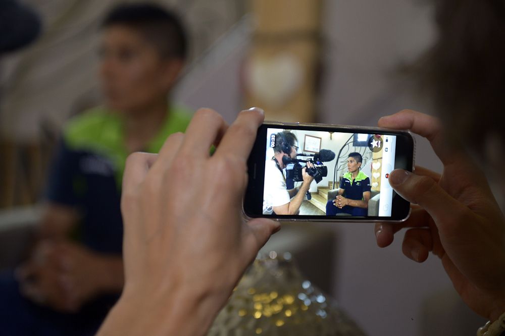 A fan captures an image of Nairo Quintana.