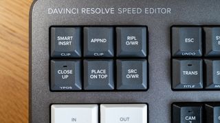 Blackmagic Davinci Resolve Speed Editor on a wooden surface