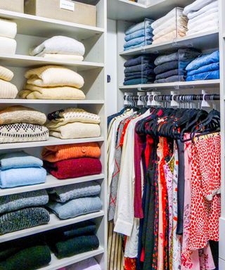 An organized closet with shelves and folded items